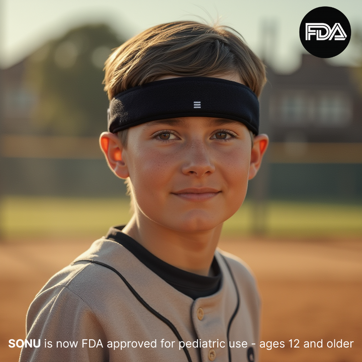 Young boy wearing a sports headband on a baseball field with FDA branding.