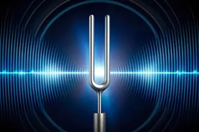 An image of a tuning fork showing vibrating sound waves emanating from the fork